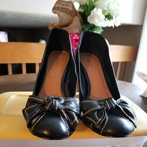 Black leather pumps